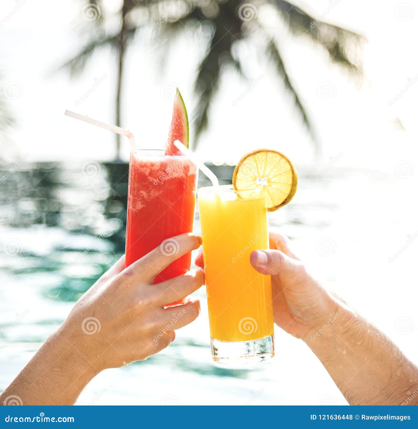 Couple Toasting with Cocktails by the Pool Stock Photo Image of