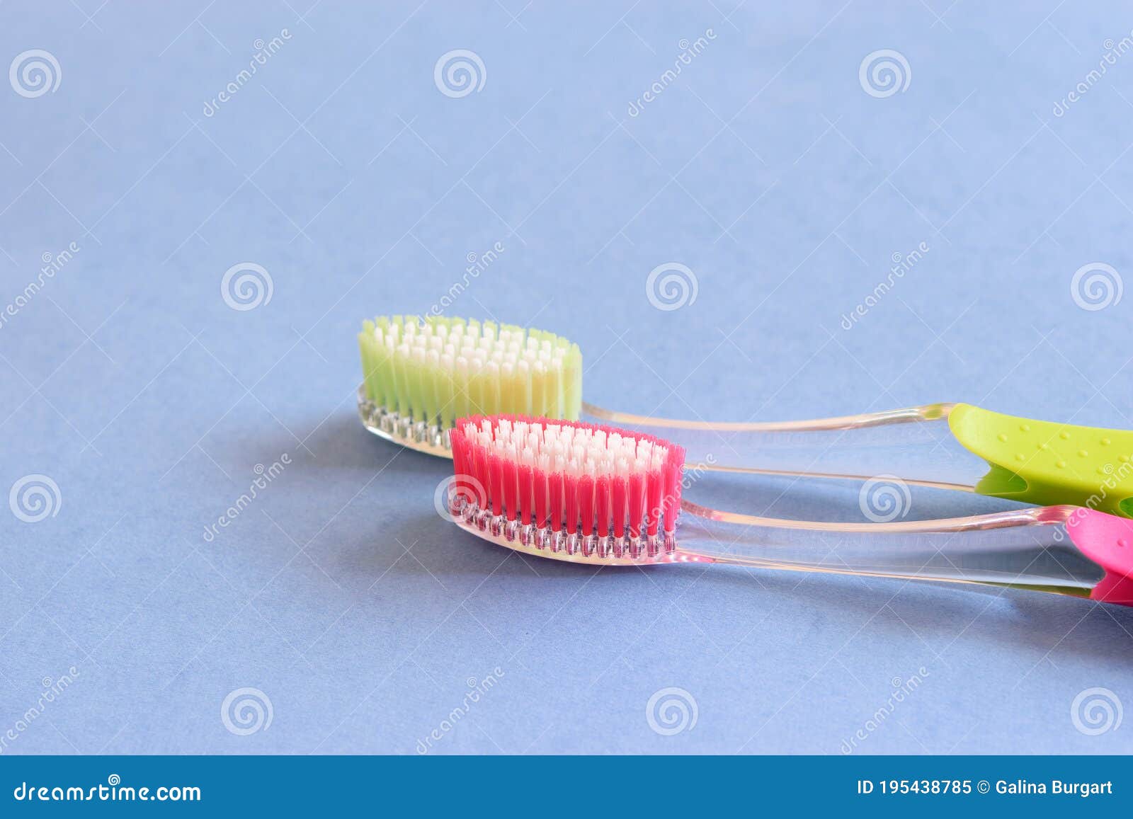 a couple of toothbrushes on the blue background, . health care, teeth whitening concept