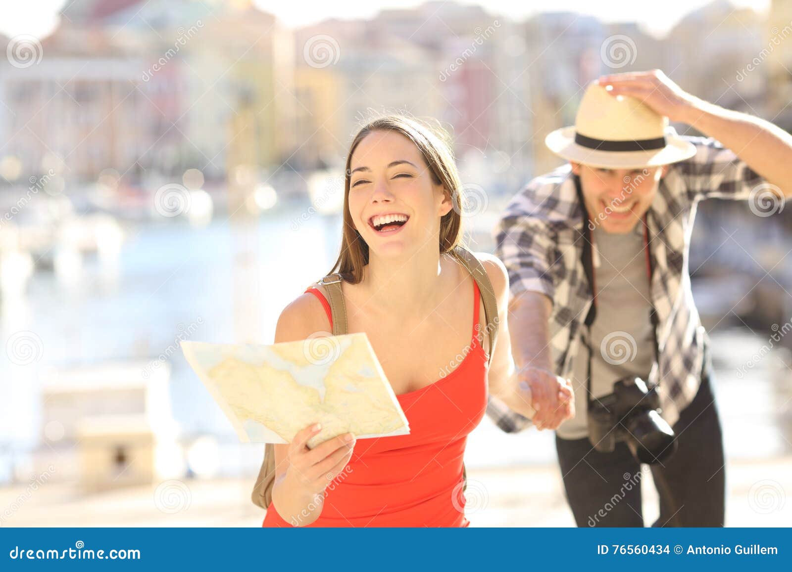 couple of tourists running in travel destination