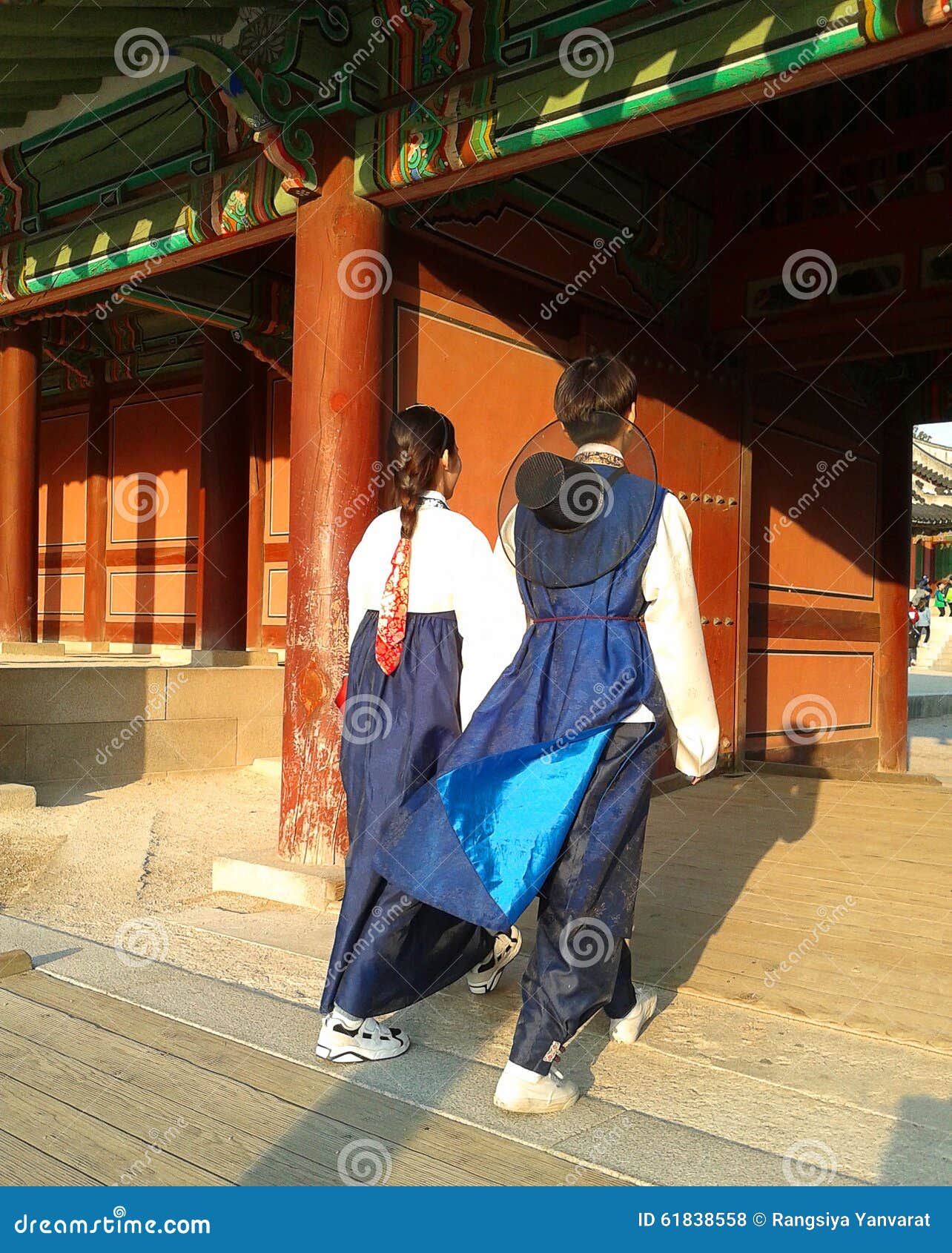 Couple in traditional Korean dress. SEOUL, KOREA - OCTOBER 28 : Young asian couple in Korean traditional dress (hanbok) walking at Changdeokgung palace on october 28, 2015 in Seoul, Korea.