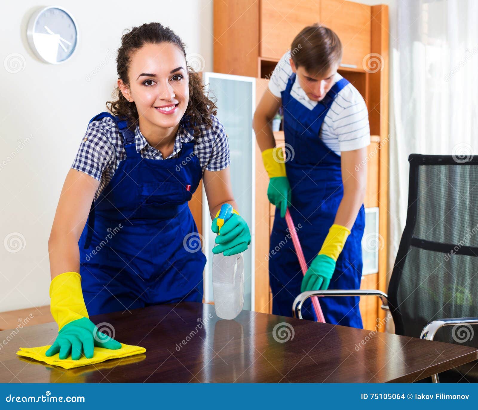 Couple in Uniform Cleaning Indoors Stock Photo Image of people
