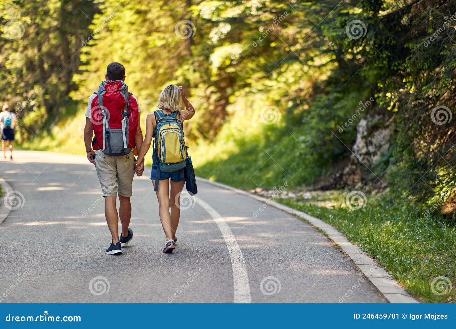 Couple Walking with Backpacks and Enjoying in Nature Stock Image
