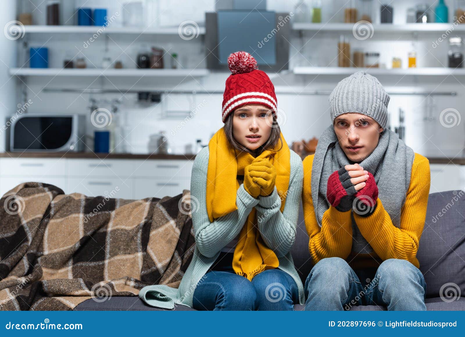couple in warm hats and gloves