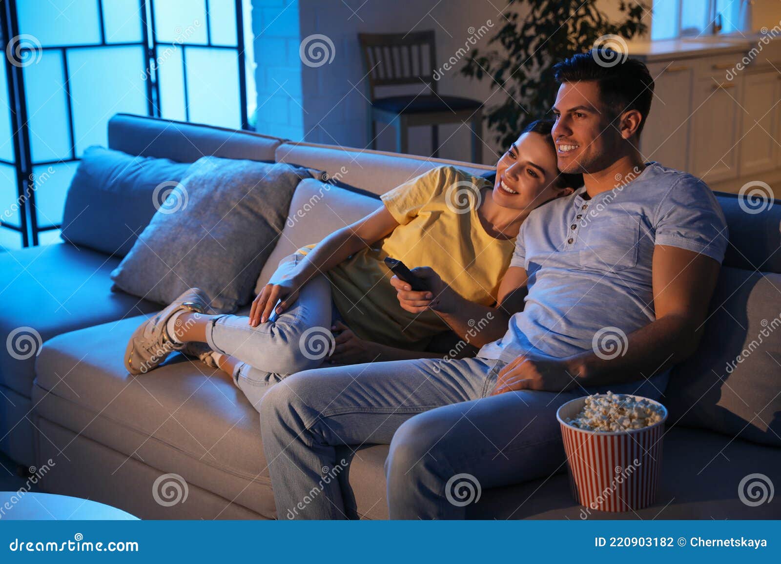 Couple Watching Movie with Popcorn on Sofa Stock Photo Image of love