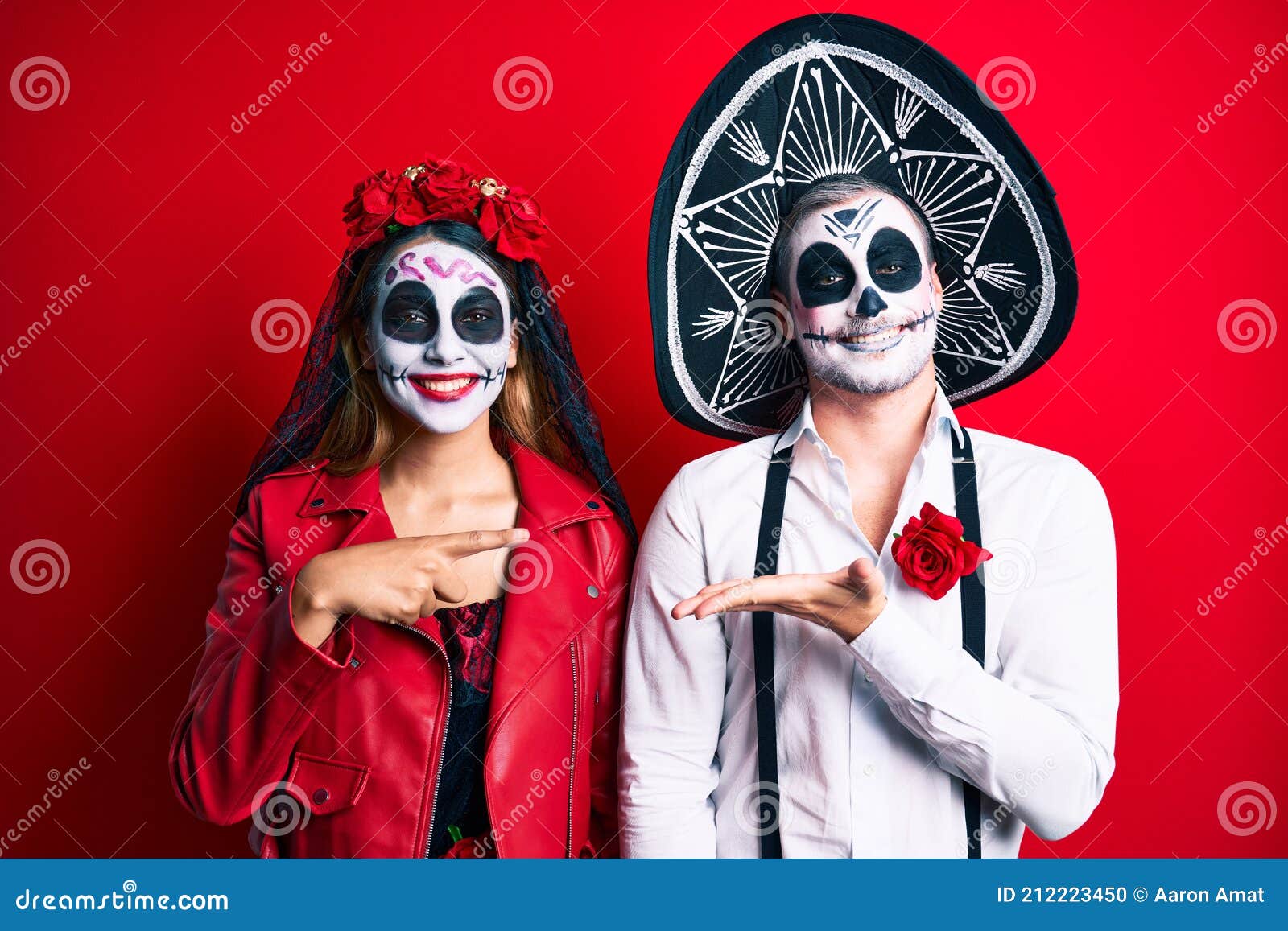 Couple Wearing Day of the Dead Costume Over Red Amazed and Smiling To ...