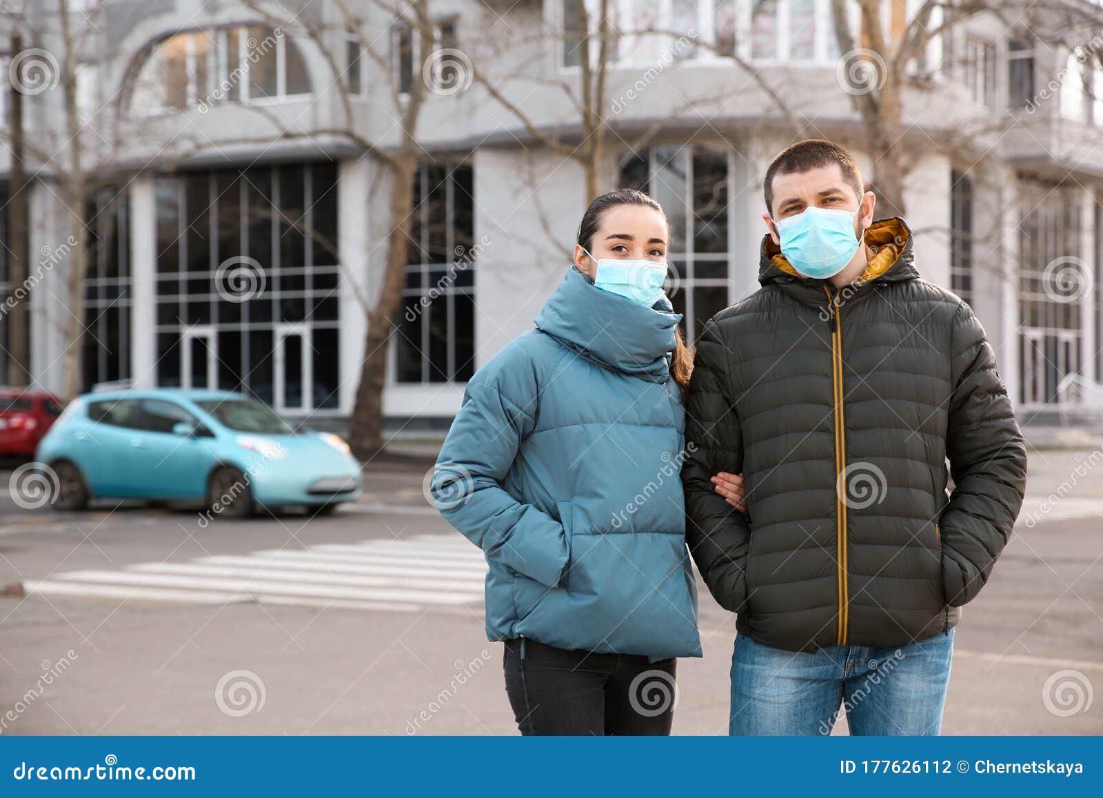 couple wearing disposable masks. dangerous virus