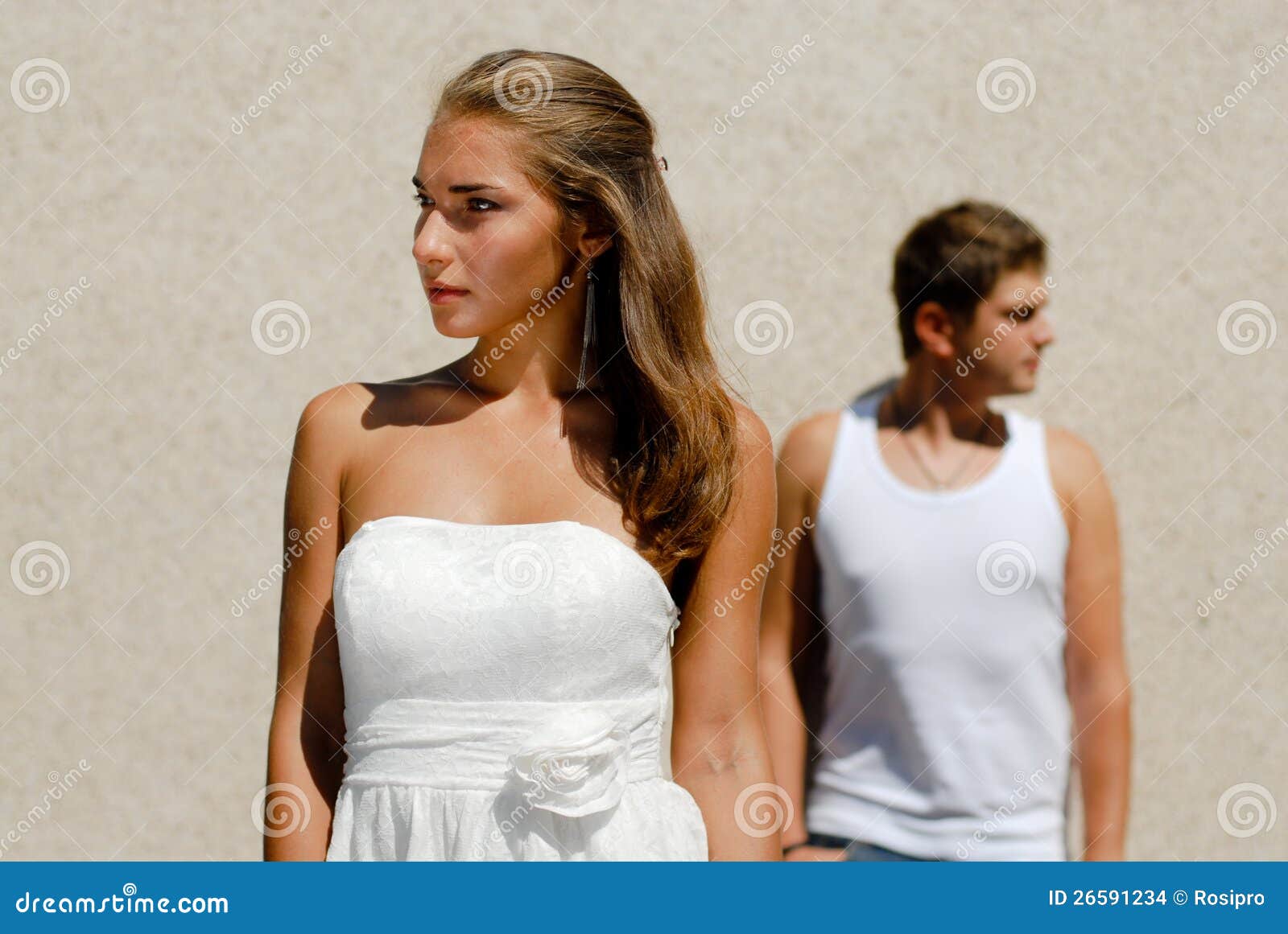 Couple in White Looking in Opposite Directions Stock Photo Image of