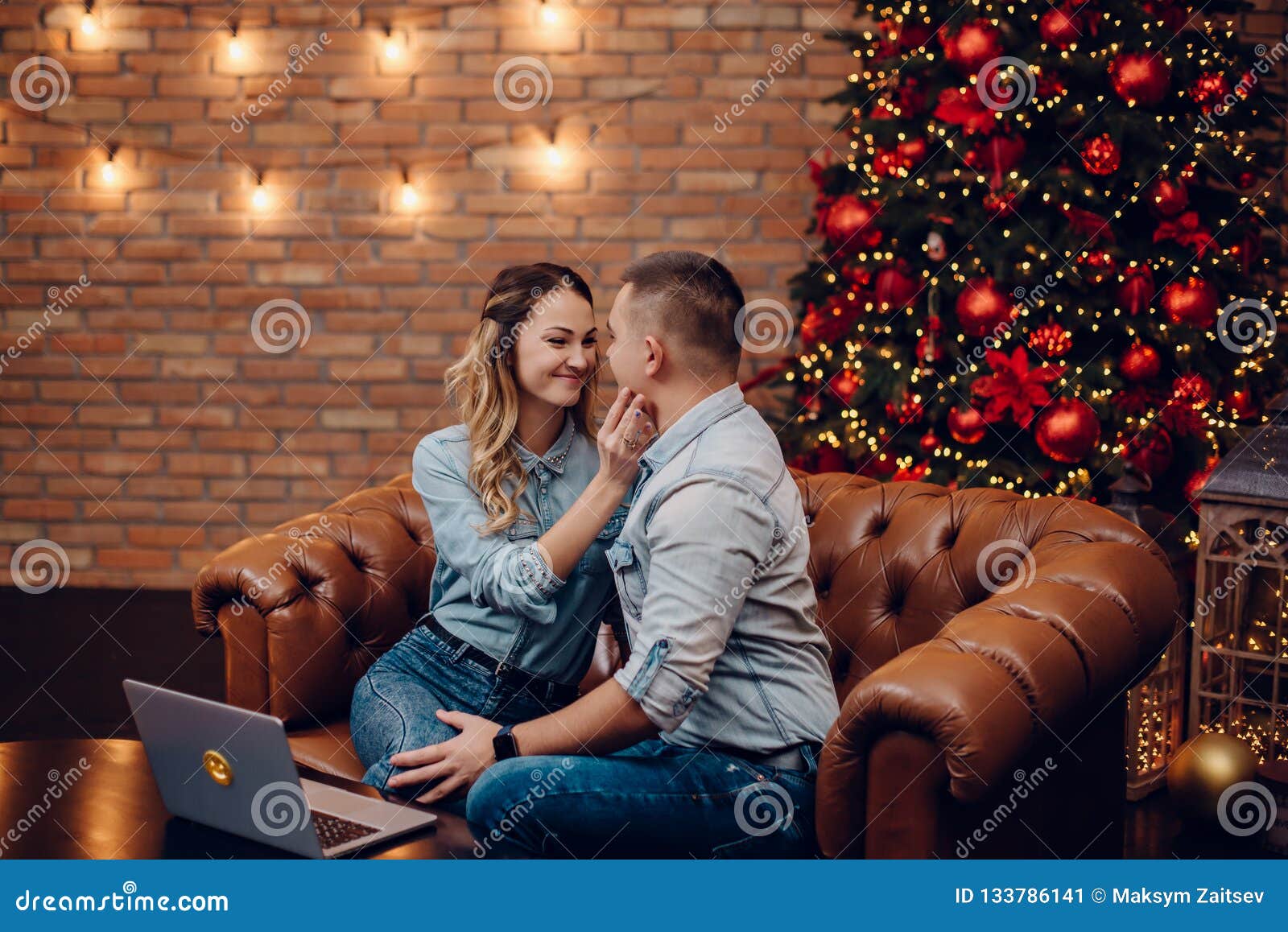 Young Couple Chatting With Relatives Via Webcam Stock Im