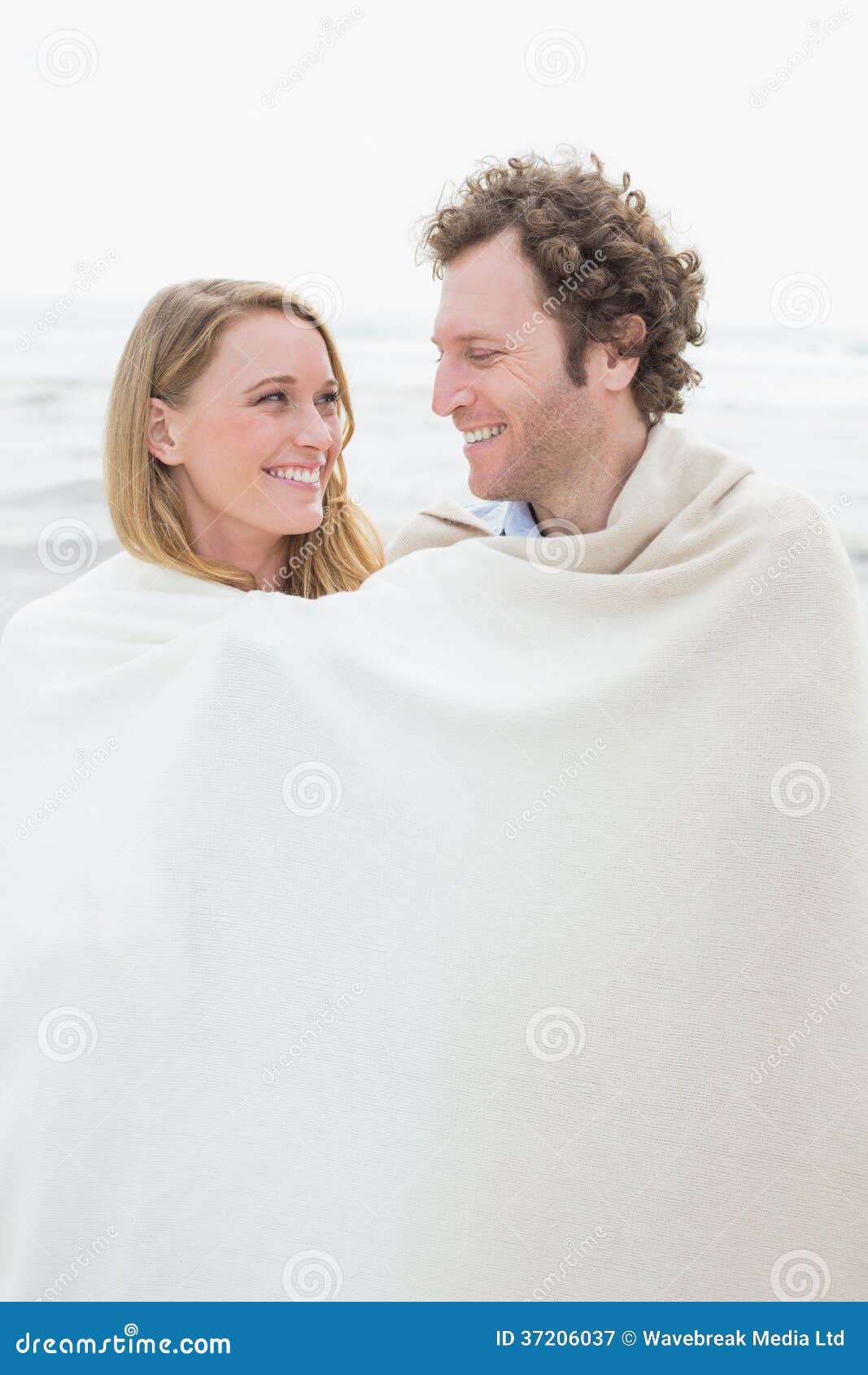 Couple Wrapped in Blanket at Beach Stock Image Image of caucasian