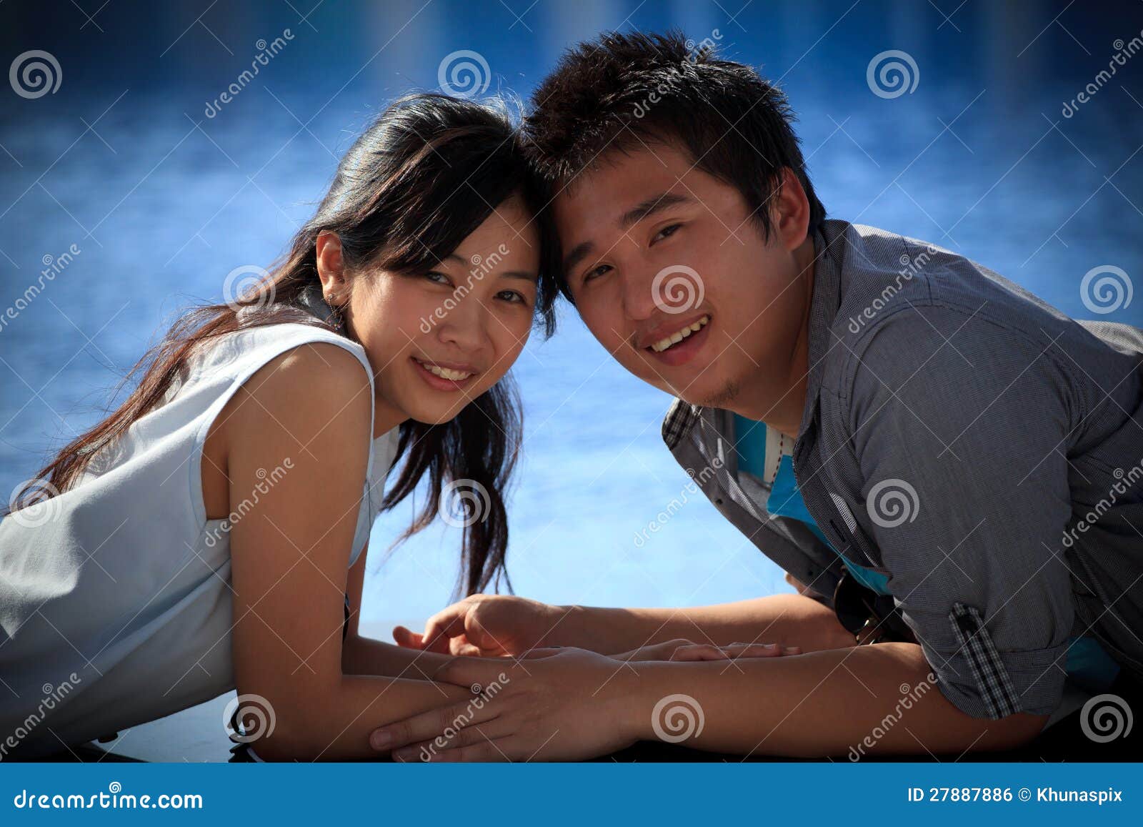 couples of asian man and woman at water pool