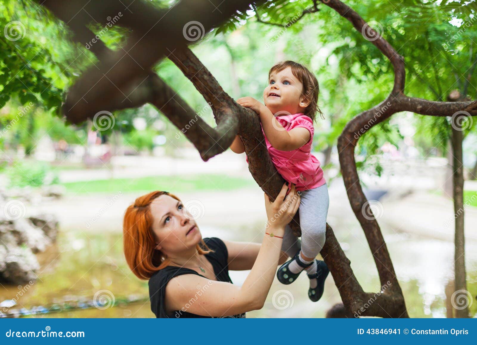 courageous girl climbing on tree