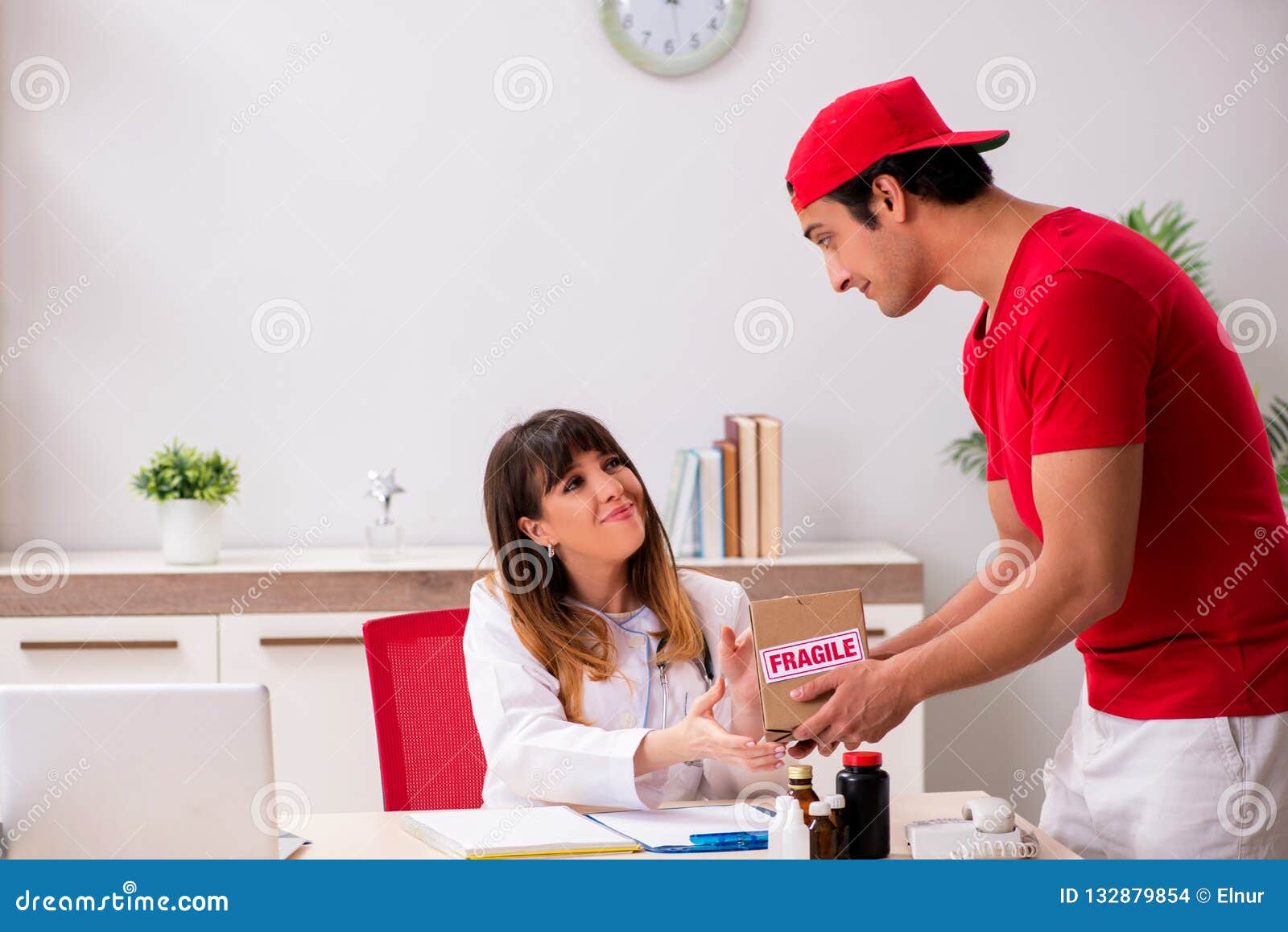 The Courier Delivering Urgent Parcel To the Hospital Stock Photo