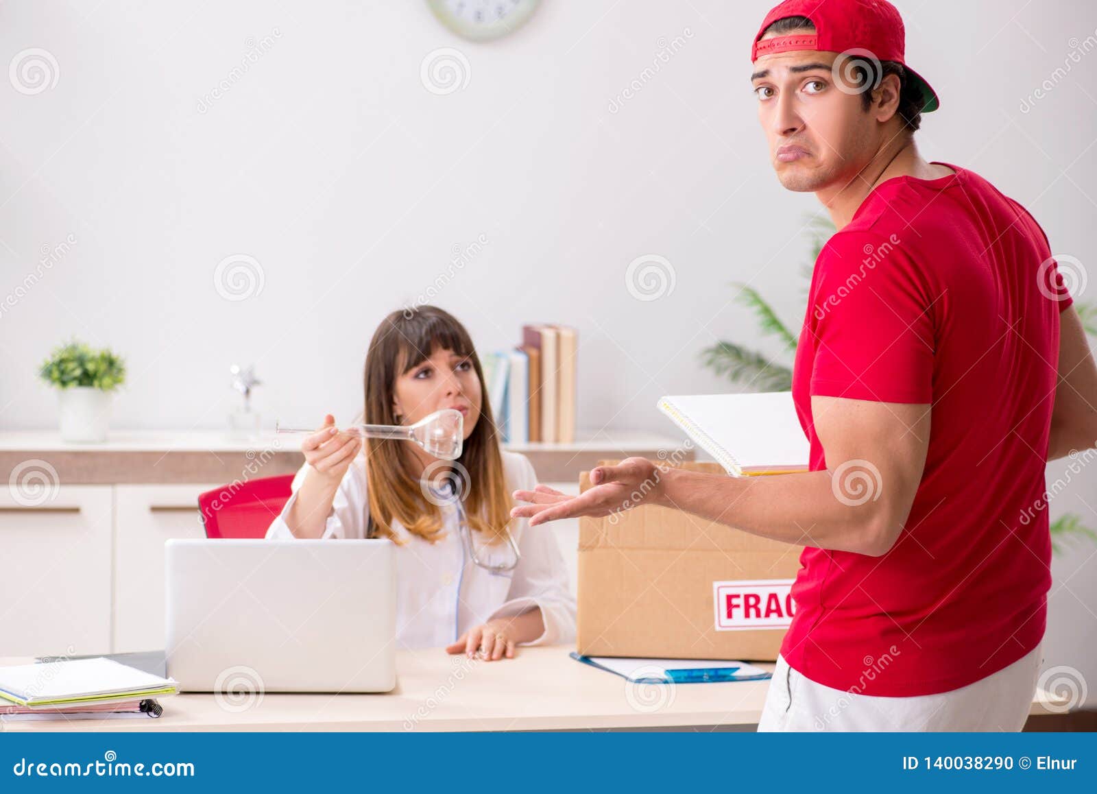 The Courier Delivering Urgent Parcel To the Hospital Stock Photo