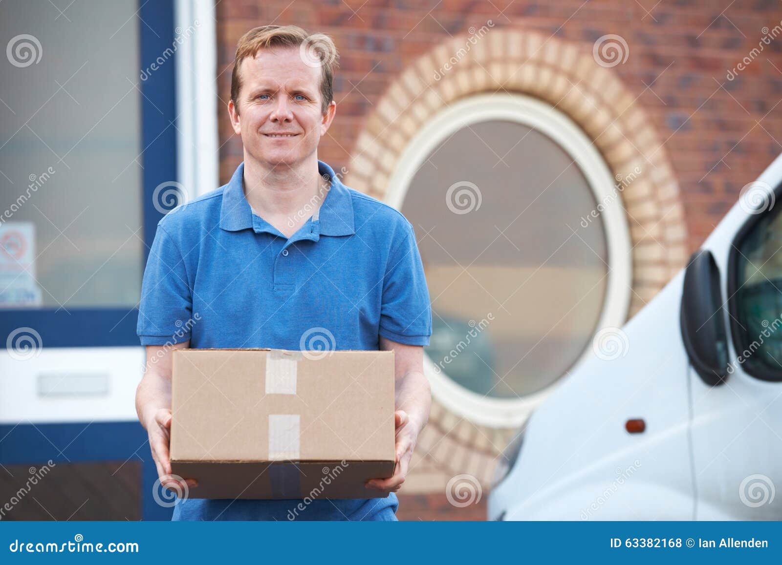 Courier Making Delivery To Office Stock Photo Image of friendly