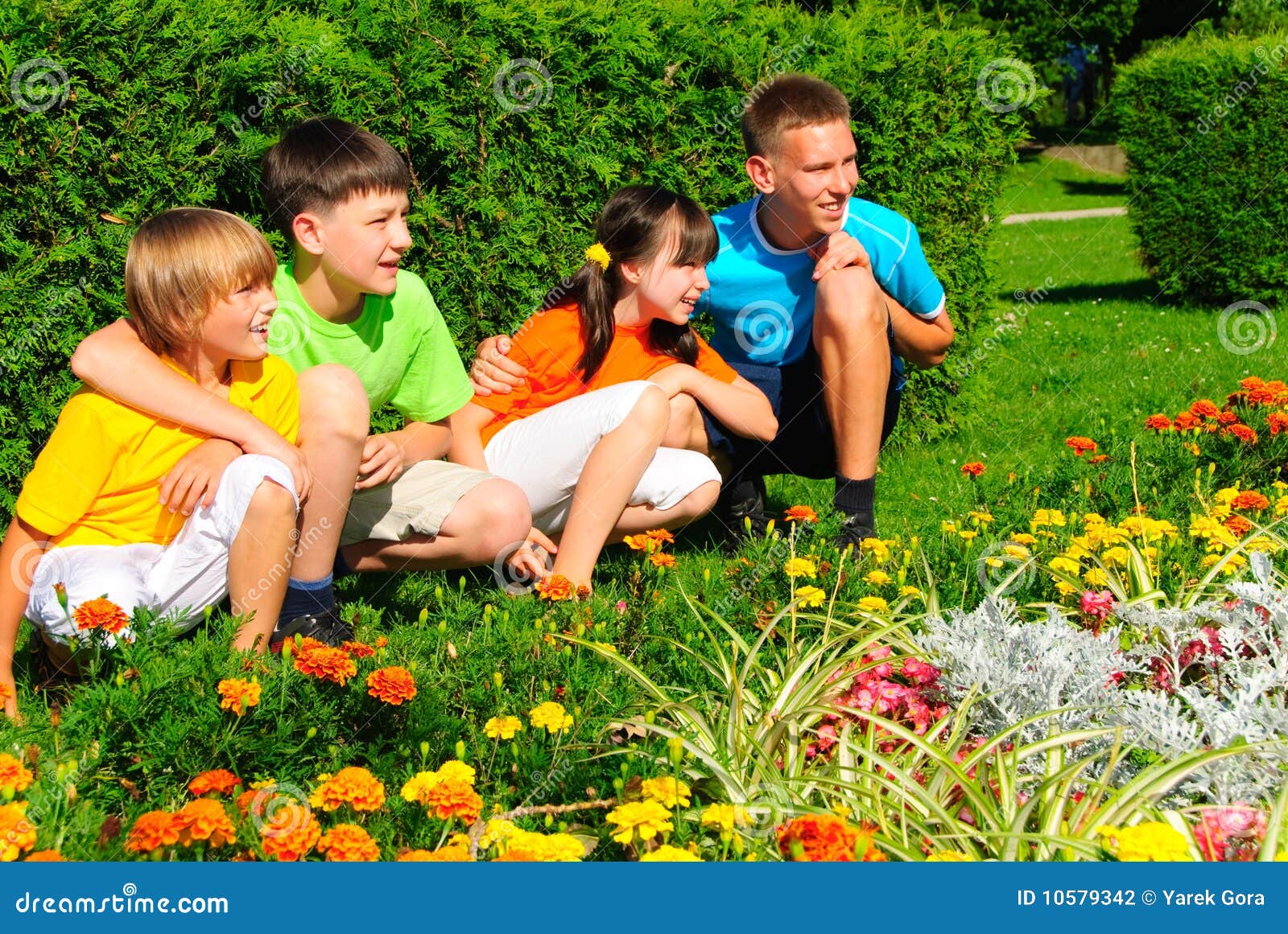 Cousins by flower garden stock photo. Image of brothers 10579342