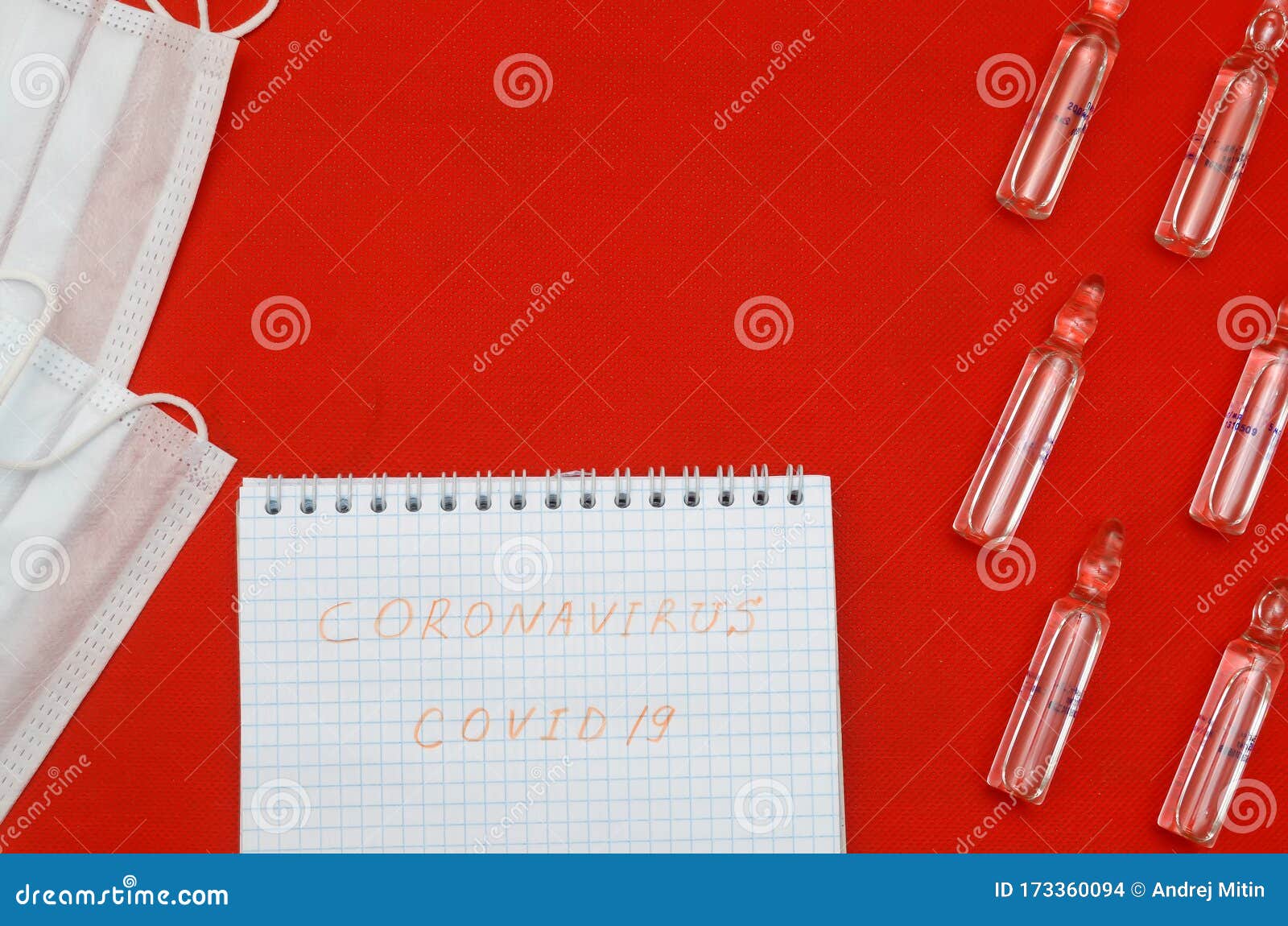 covid19.epidemia of coronavirus infection.medical masks and ampoules to treat the virus on red background.