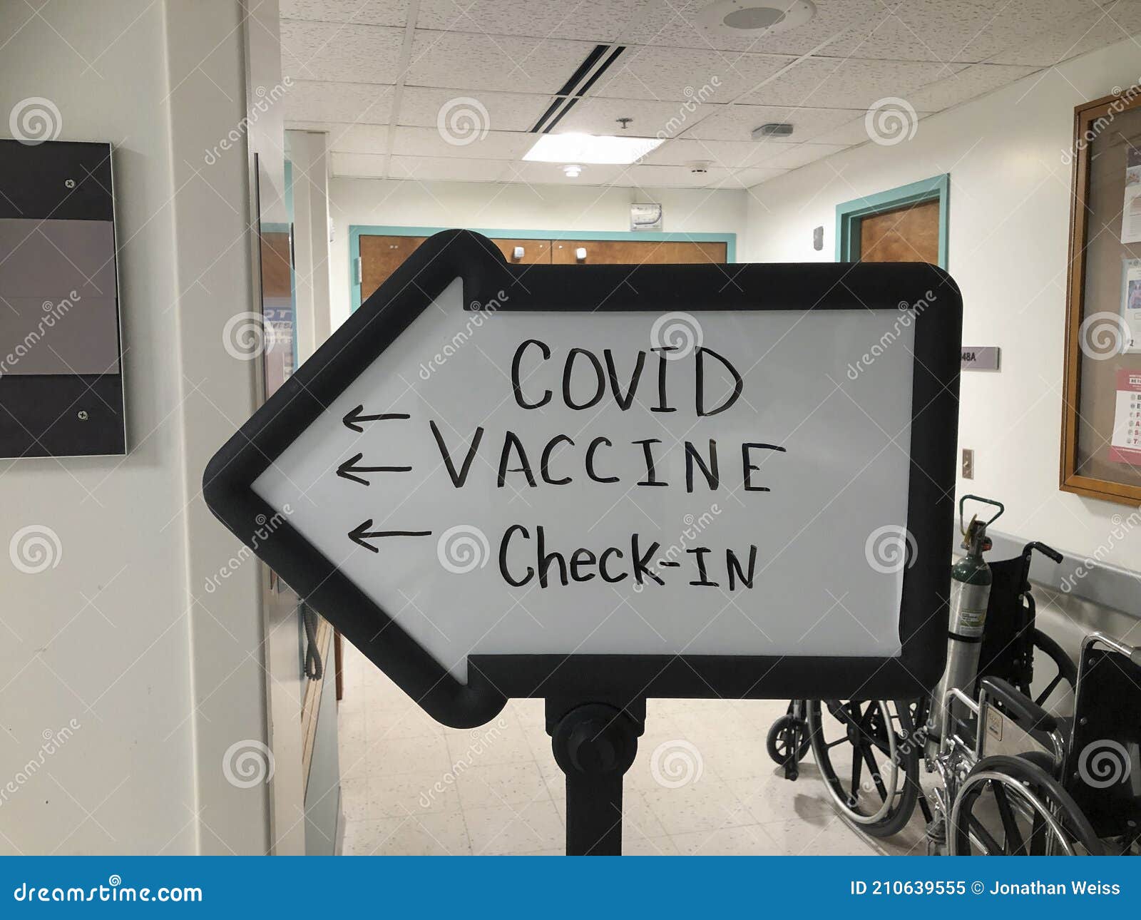 covid-19 vaccine check in at a hospital. as companies roll out more vaccine doses, more will be available for the general public