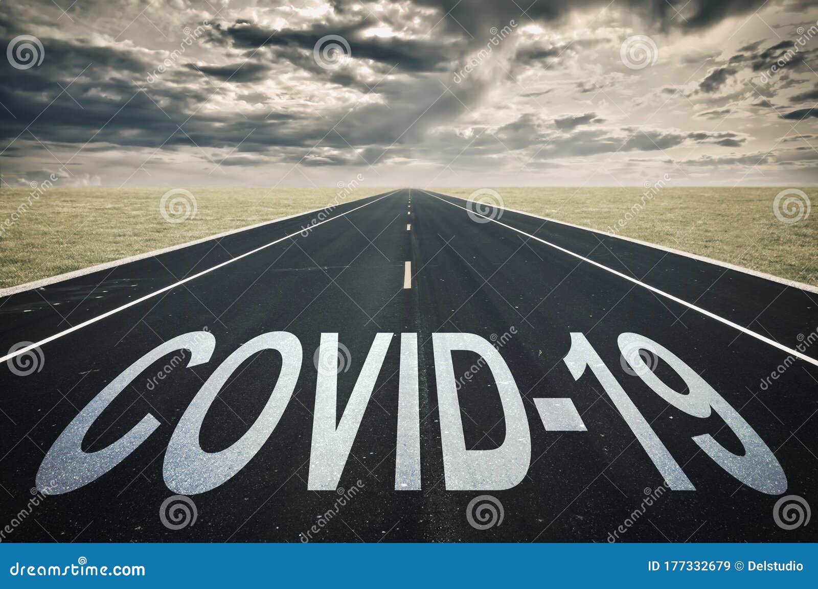 covid-19 written on a road, dark clouds, coronavirus epidemic concept