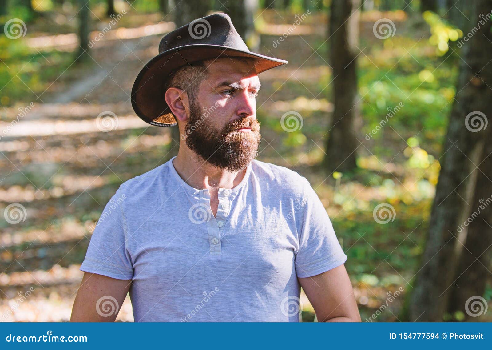 Cowboy Couture. Bearded Man in Cowboy Hat Walk in Park Outdoor. Man ...