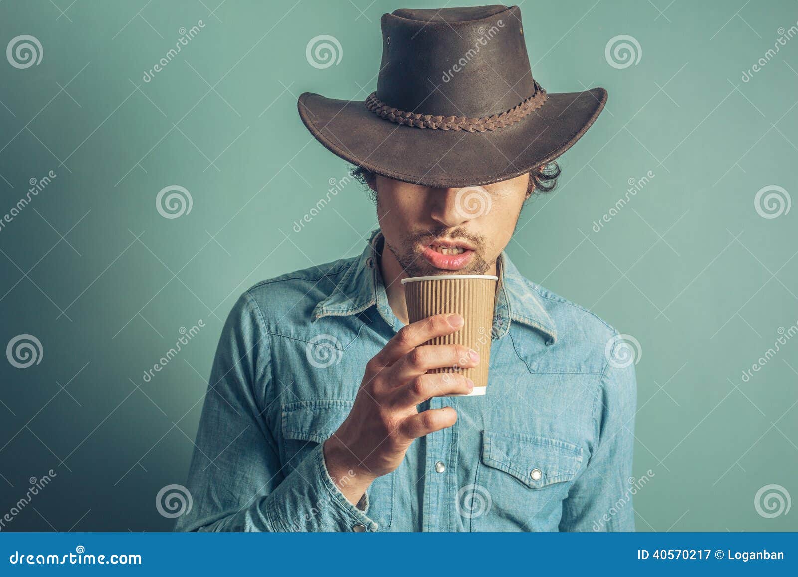Cowboy drinking coffee stock image. Image of leather 40570217