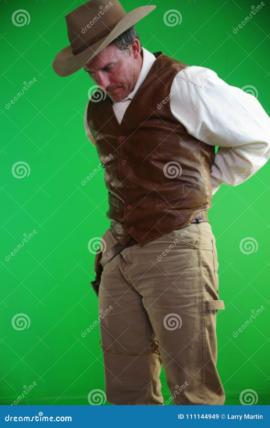 cowboy holding revolver