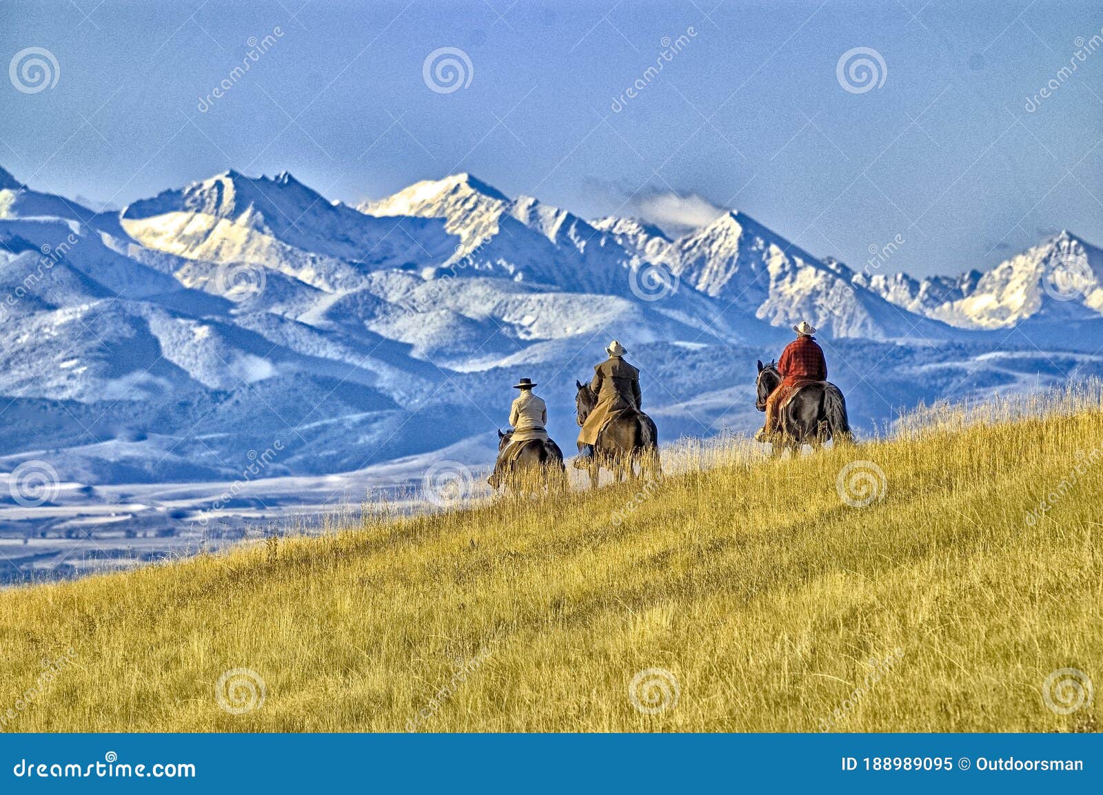 cowboys on the range mountain background