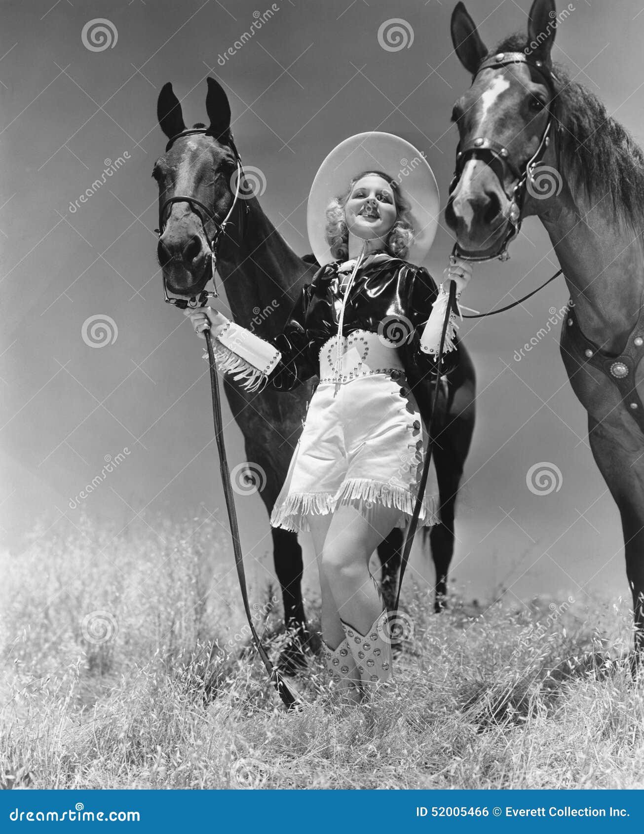 cowgirl with two horses