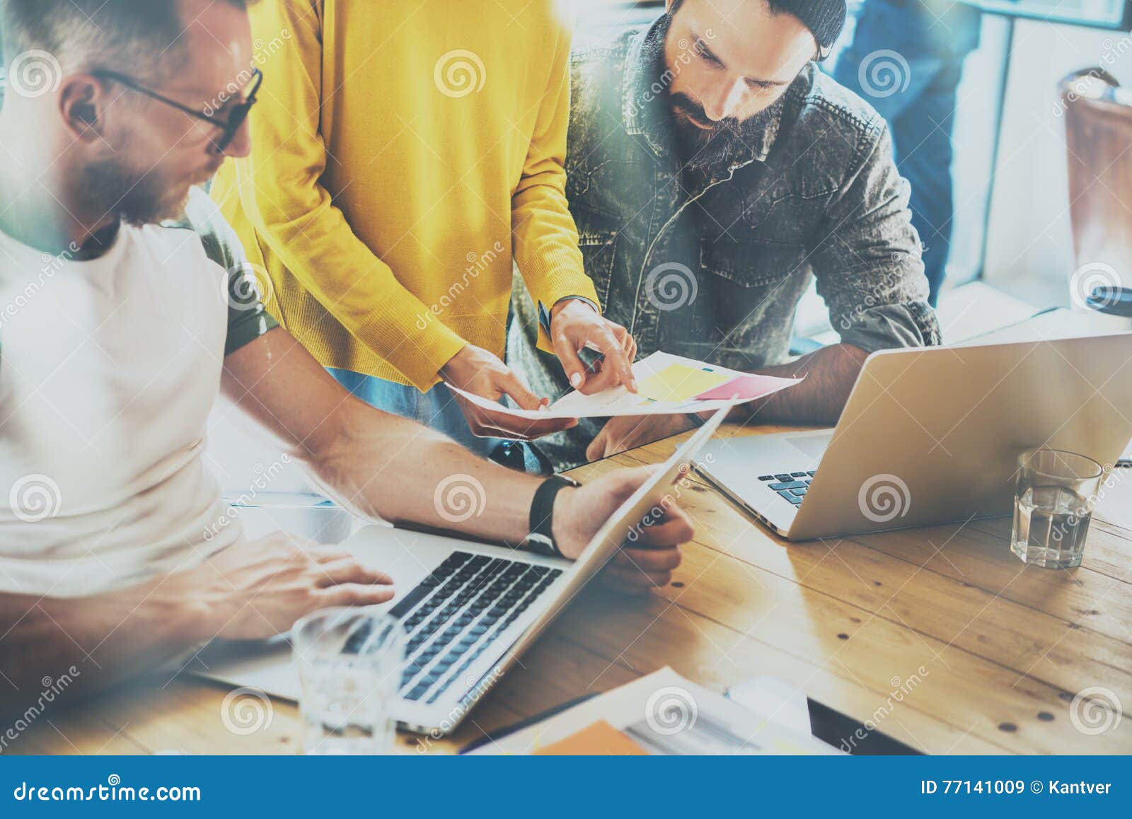 coworkers team work modern office place.account manager showing new business idea startup presentation.woman holding