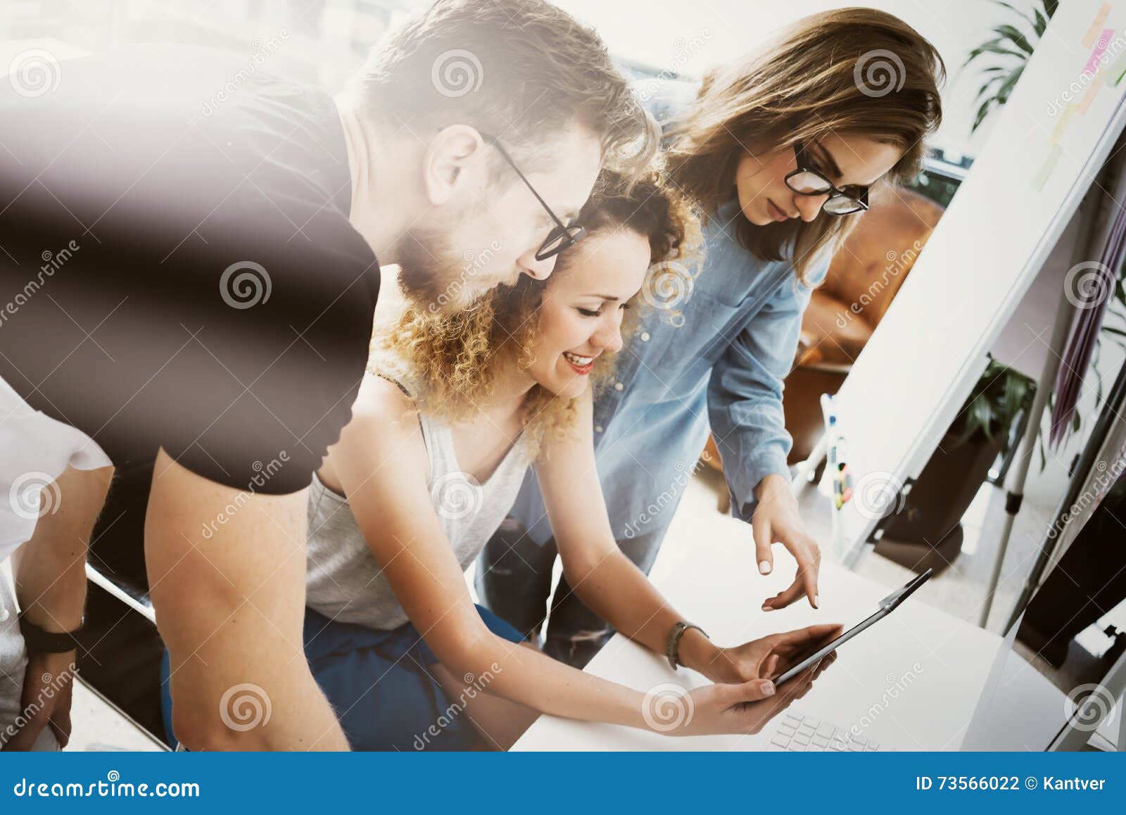 coworkers team work modern office place. account manager showing new business idea startup presentation. woman touching