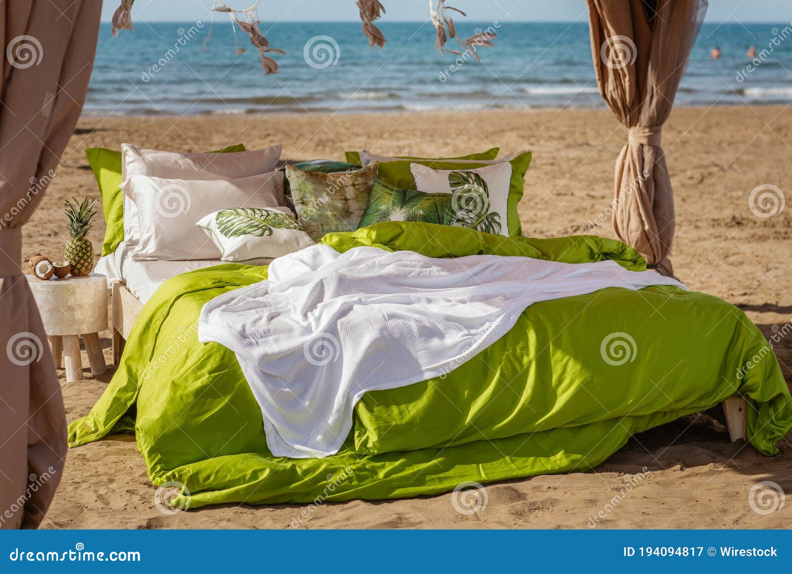 Cozy Bed on a Beach in Green Bed Linen Stock Image - Image of relax ...