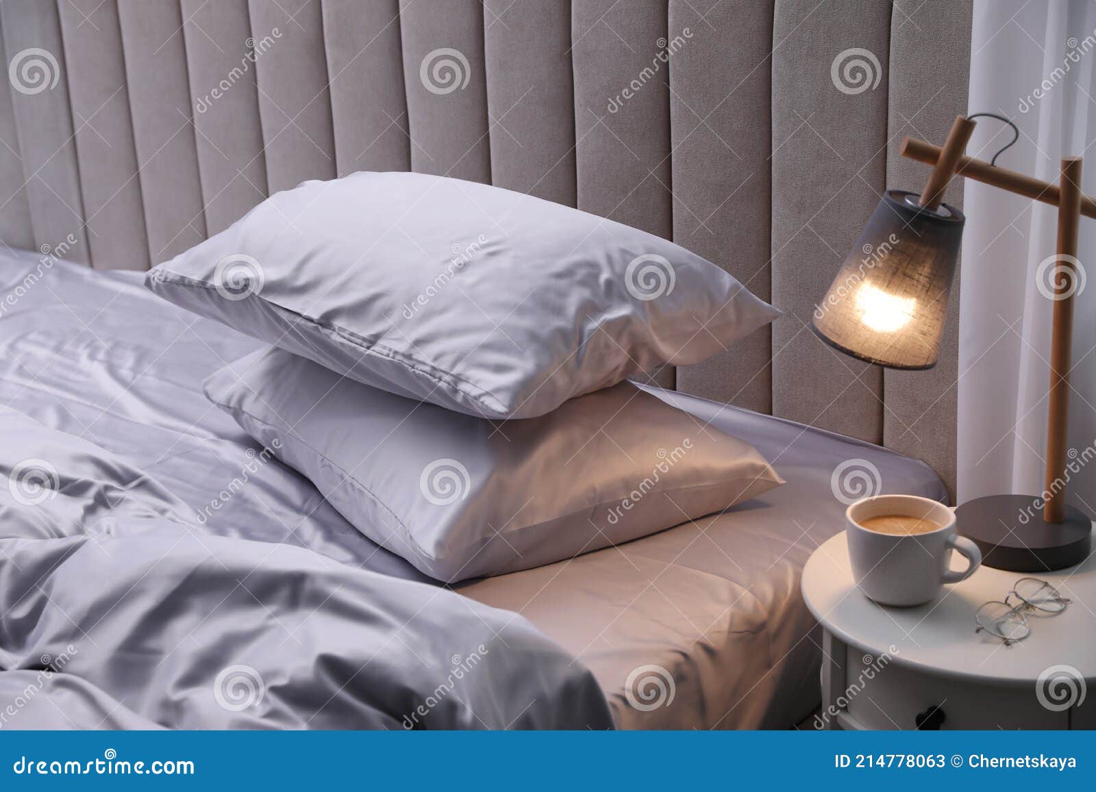 Cozy Bed with Soft Silky Bedclothes in Light Room Stock Image Image