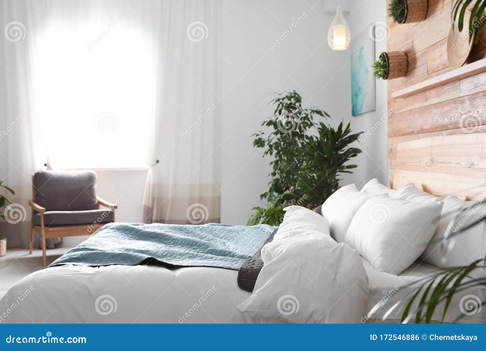 Cozy Bedroom Decorated with Plants. Home Design Ideas Stock Photo ...