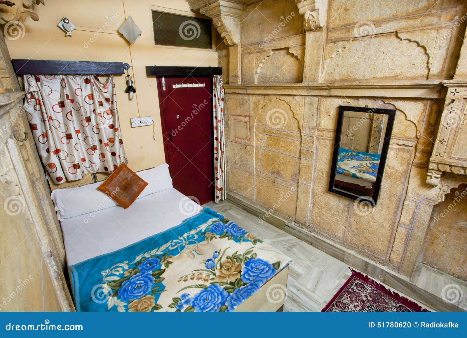 Cozy Room With A Bed And Carpet In Historical House Stock