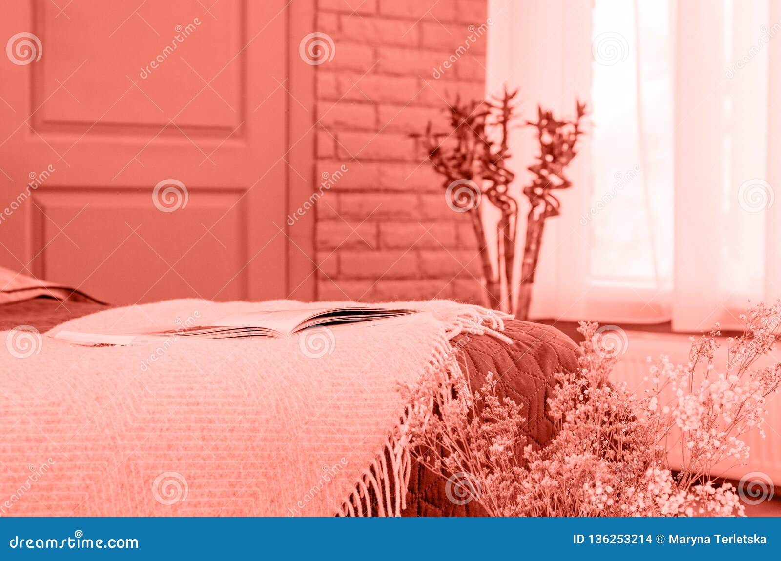 A Cozy Room With A Bed And A Large Window In Coral Color