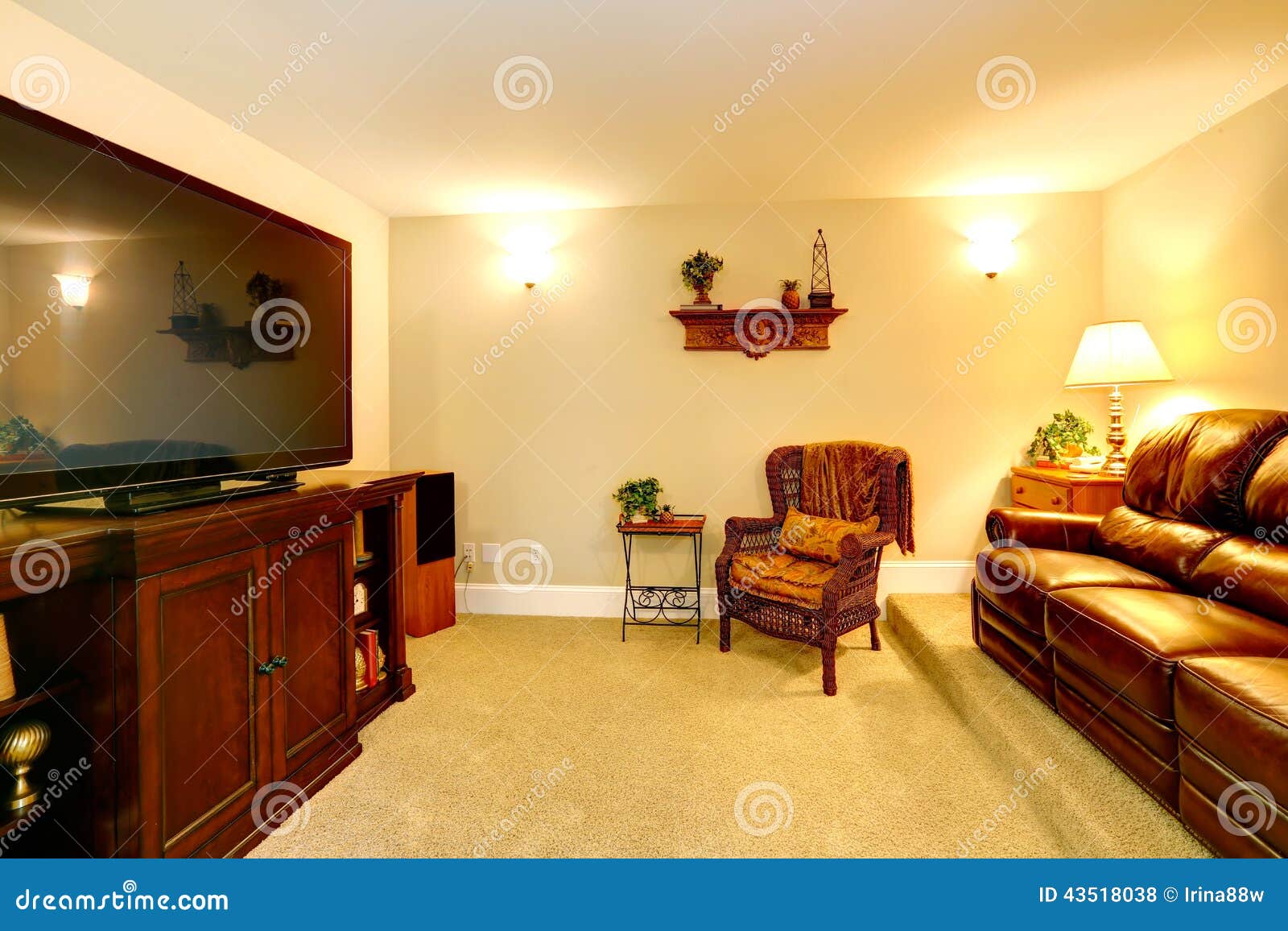 Cozy room with leather couch and TV. Cozy room wiht leather couch, wicker chair and cabinet with TV