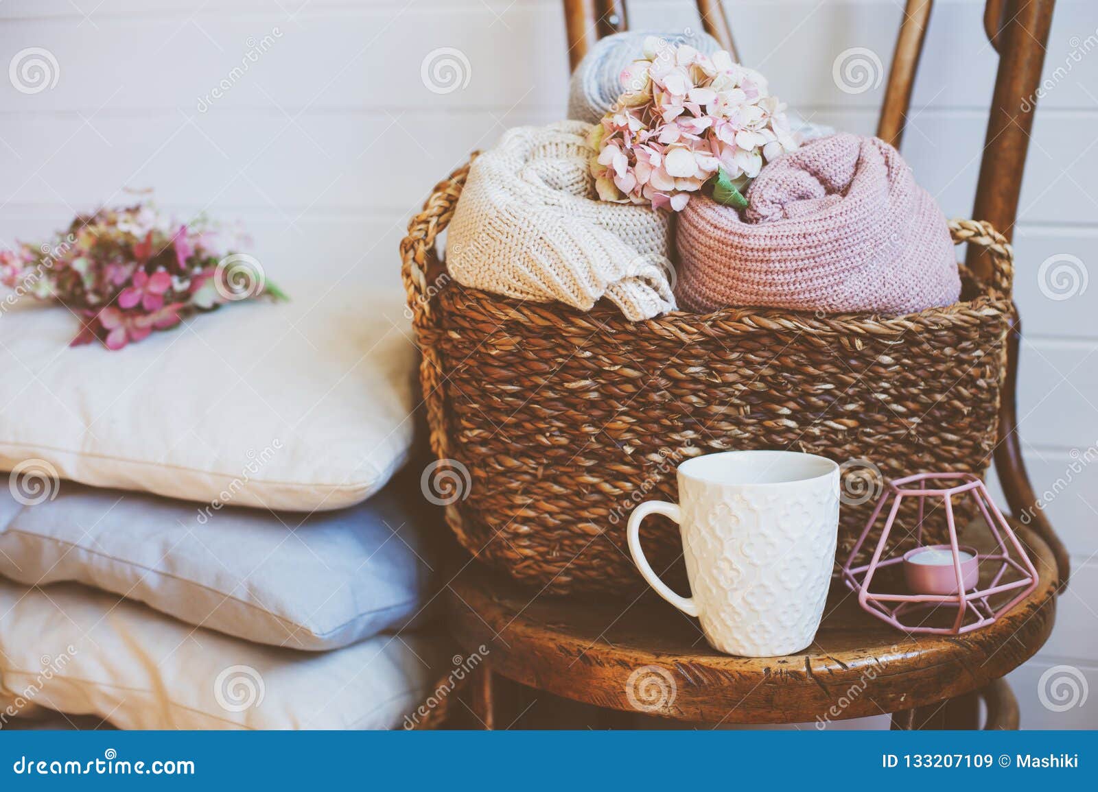 cozy still life interior details. organizing clothes in wicker baskets