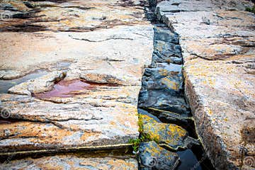 Black Intrusive Igneous Basalt Rock and Granite at Schoodic Point in
