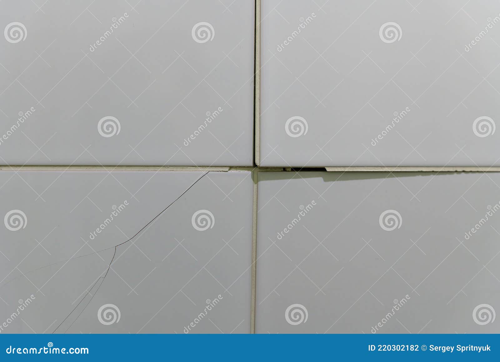 Cracked, Broken Bathroom Wall Tiles or Panels Closeup View Stock