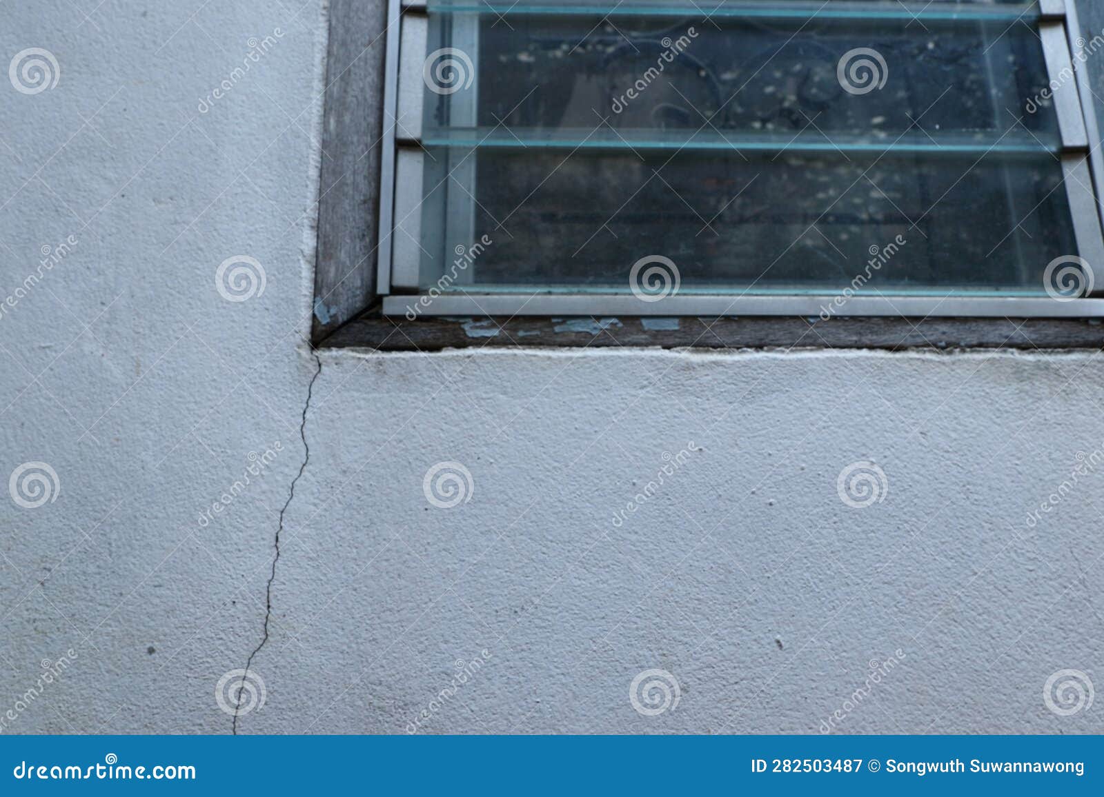 Cracked Concrete House the Outer Wall of the Window is Cracked. Caused