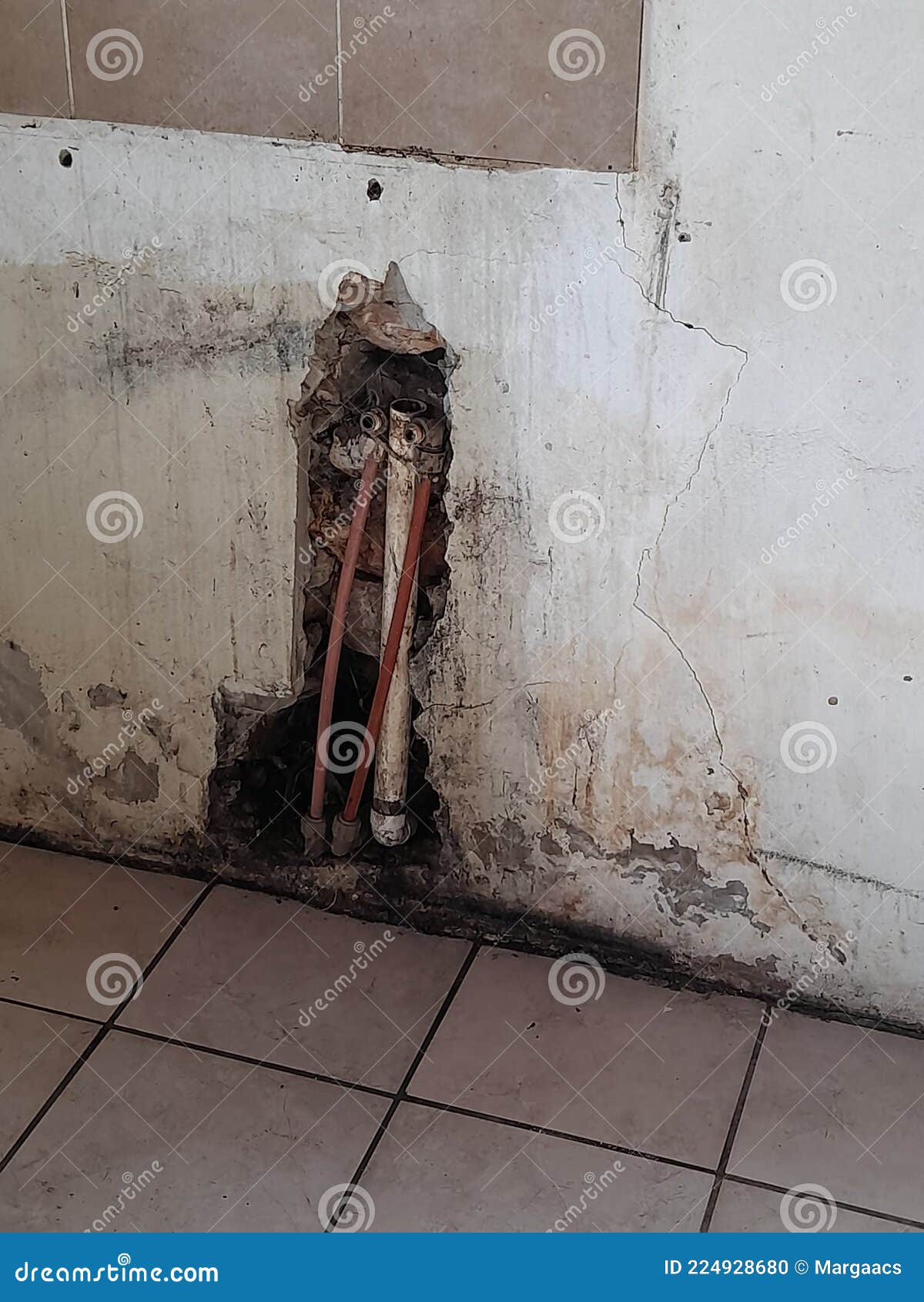 Cracked and Dirty Kitchen Wall and Exposed Pipes Stock Photo Image of