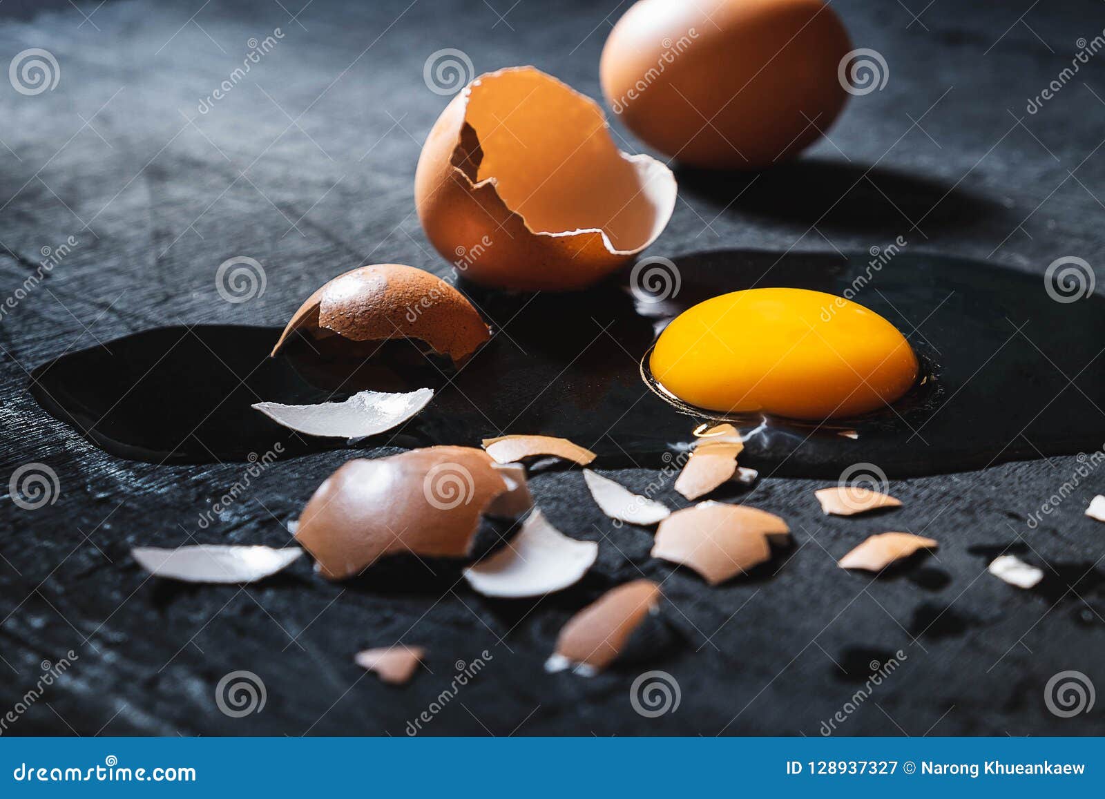 A Cracked Egg with an Egg Shell, Egg Yolk and Egg White on White Stock