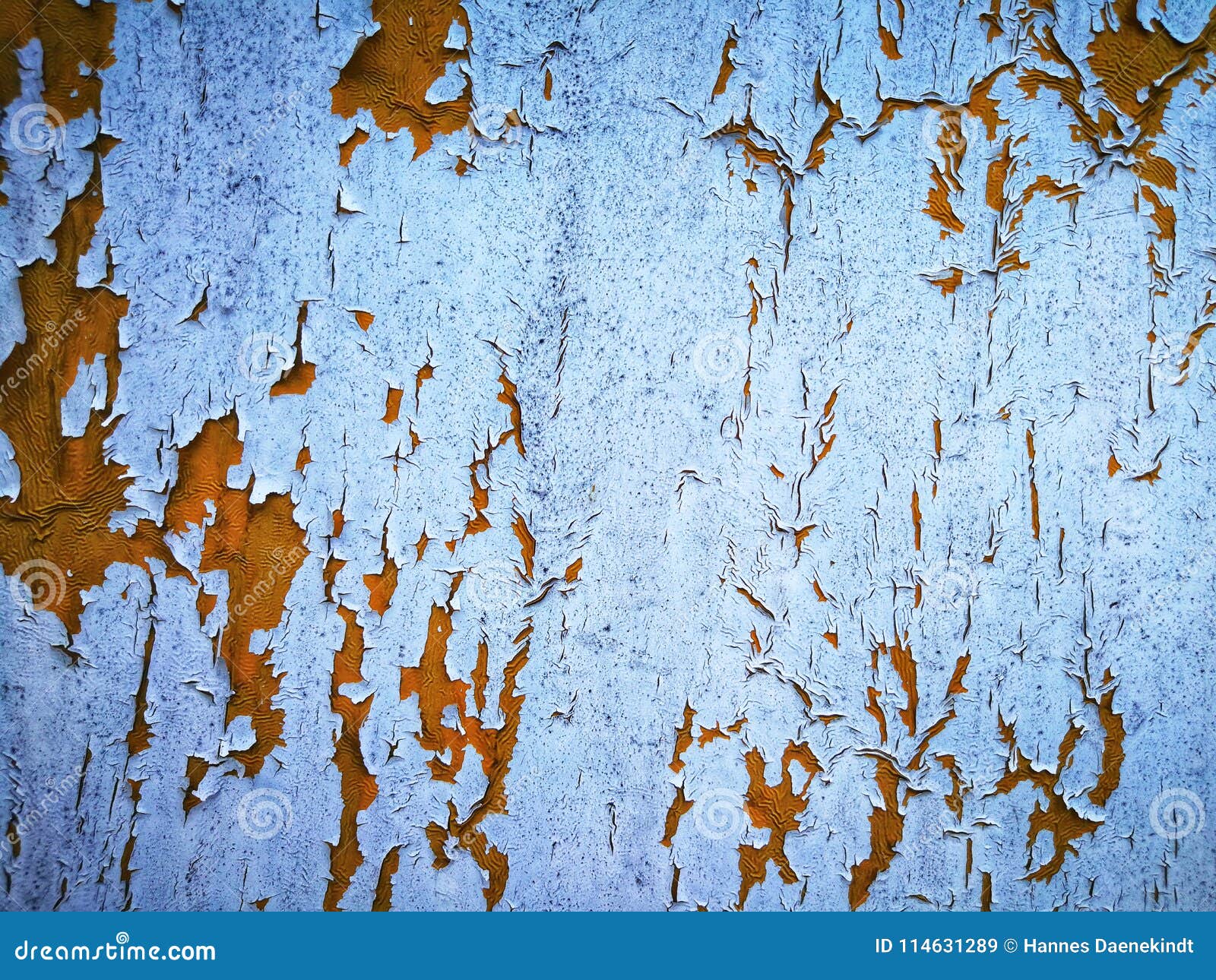 Cracked White Paint Peeling Off Revealing Layer of Yellow Paint