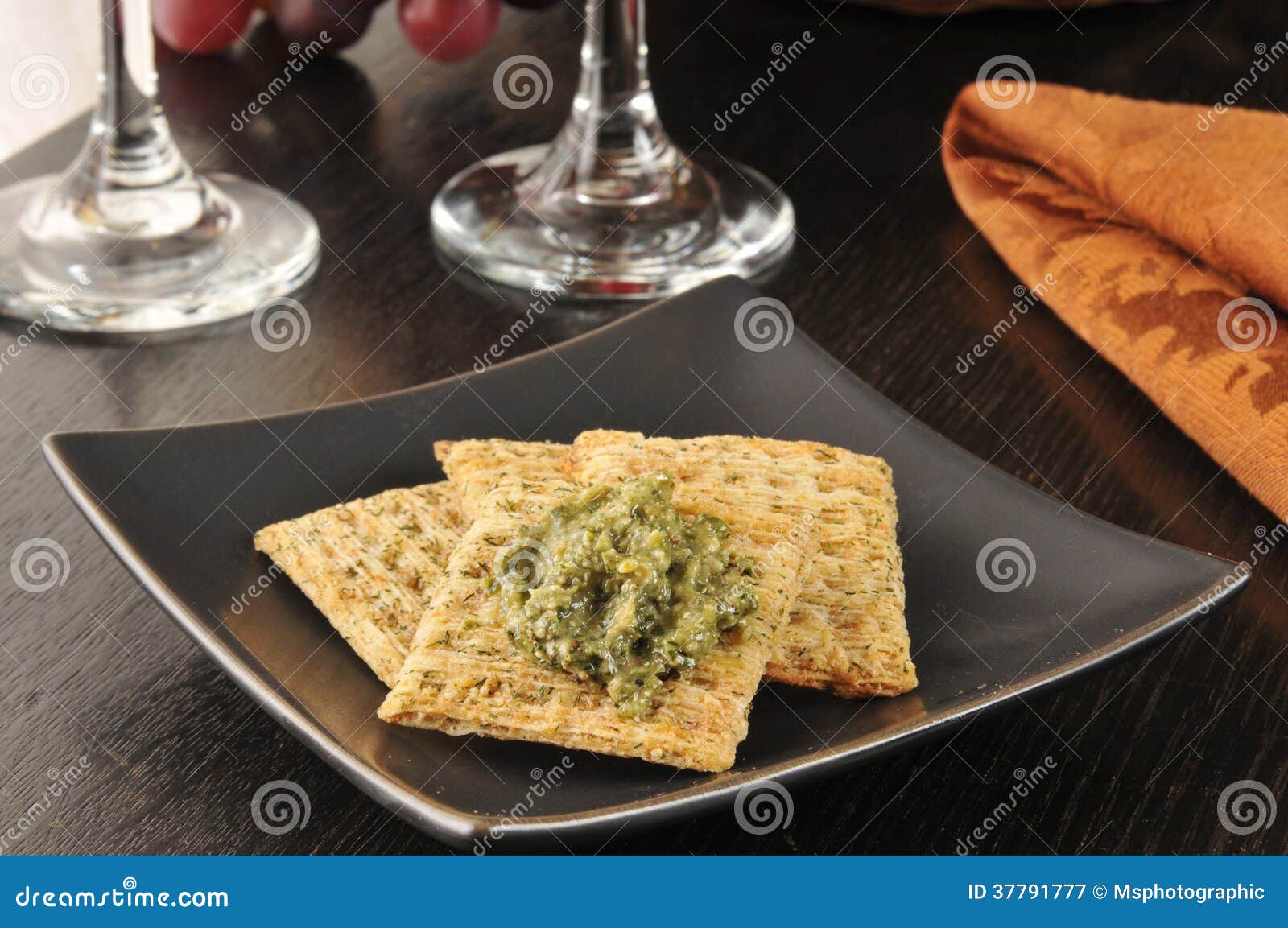 Crackers with pesto stock image. Image of shredded, garlic 37791777