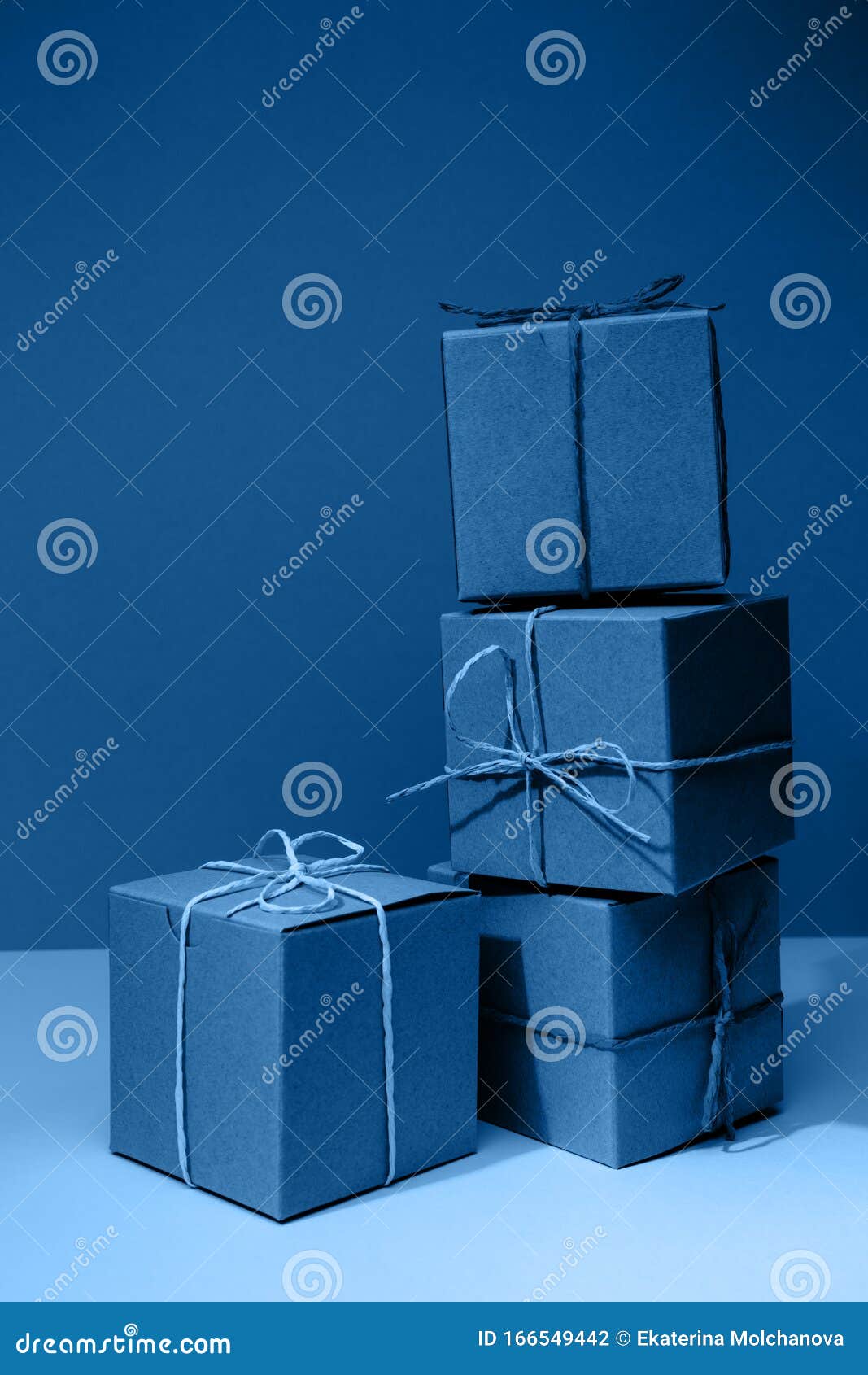 Craft Cardboard Gift Boxes on the Solid Classic Blue Background
