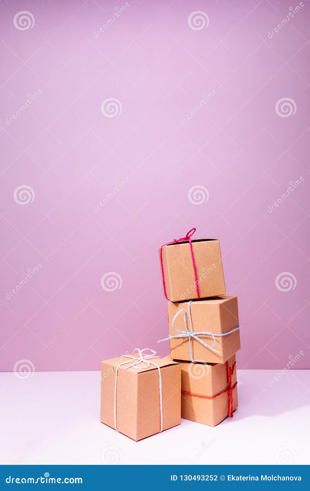 Craft Cardboard Gift Boxes on the Solid Pink Background. Holiday Stock ...