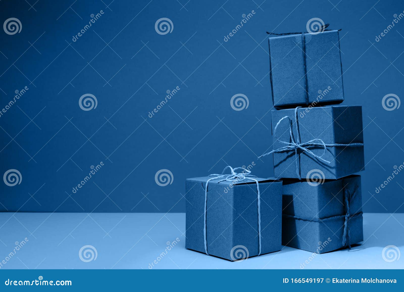 Craft Cardboard Gift Boxes on the Solid Classic Blue Background