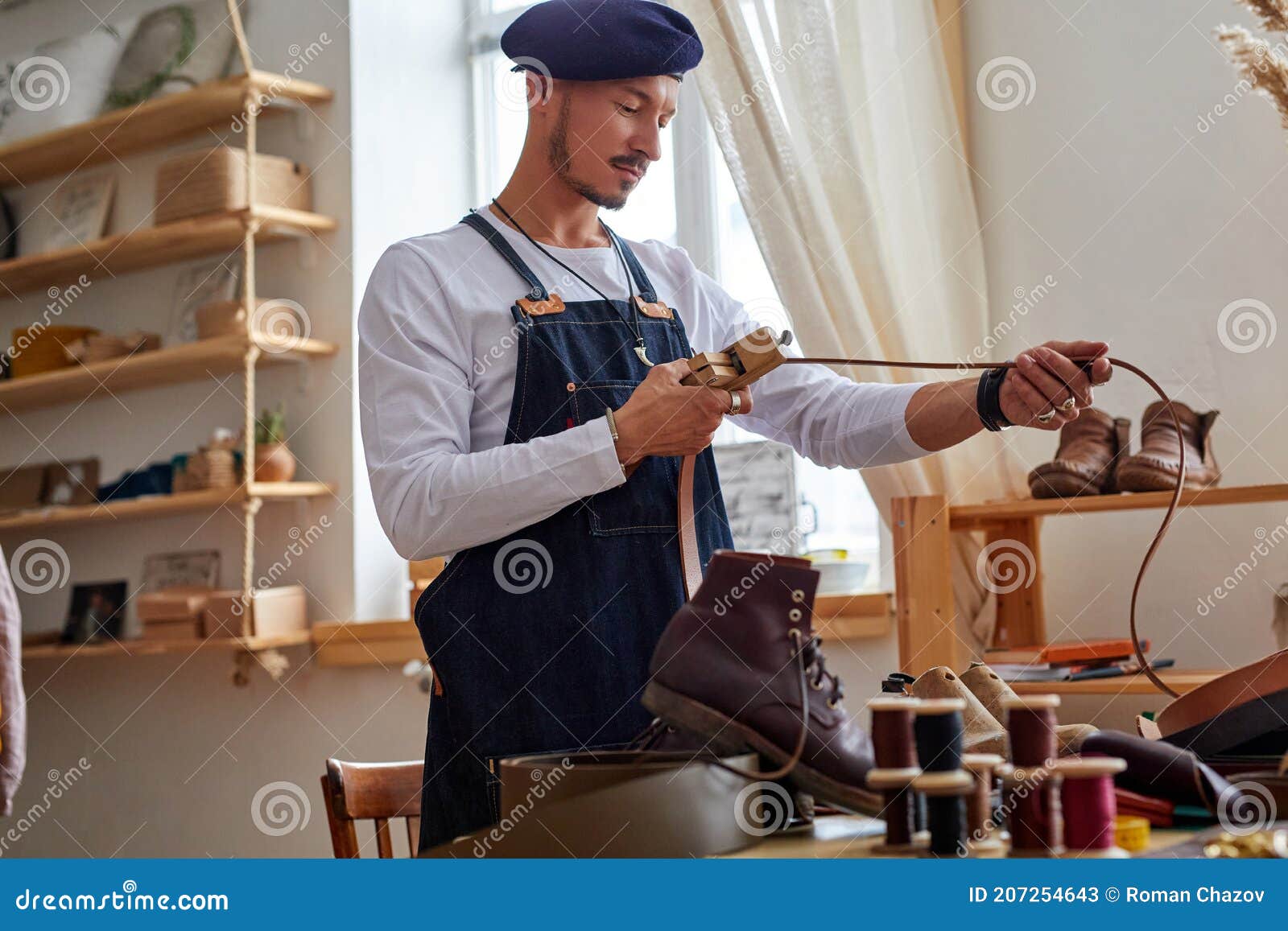 Craftsman in the Leather Concentrated on Work Stock Image