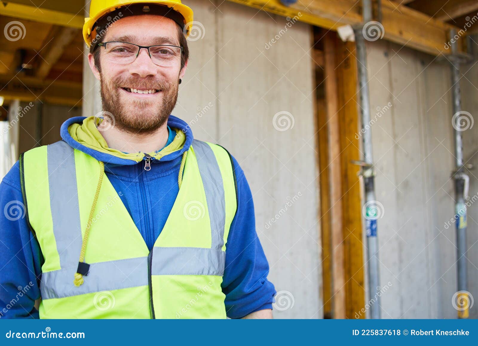 Craftsman in Protective Clothing on the Construction Site Stock Photo
