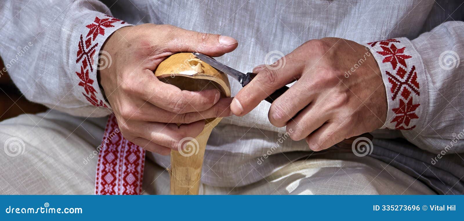 a craftsman's delicate touch: shaping a wooden spoon in a rustic workshop