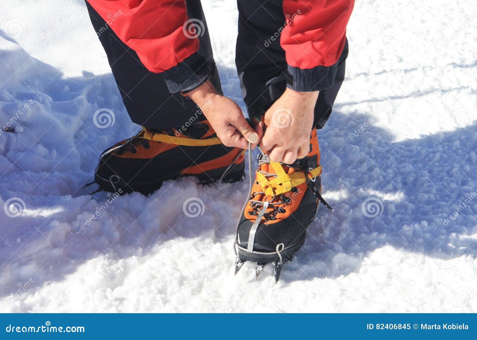 Crampons closeup. Crampons closeup. Crampon on winter boot for